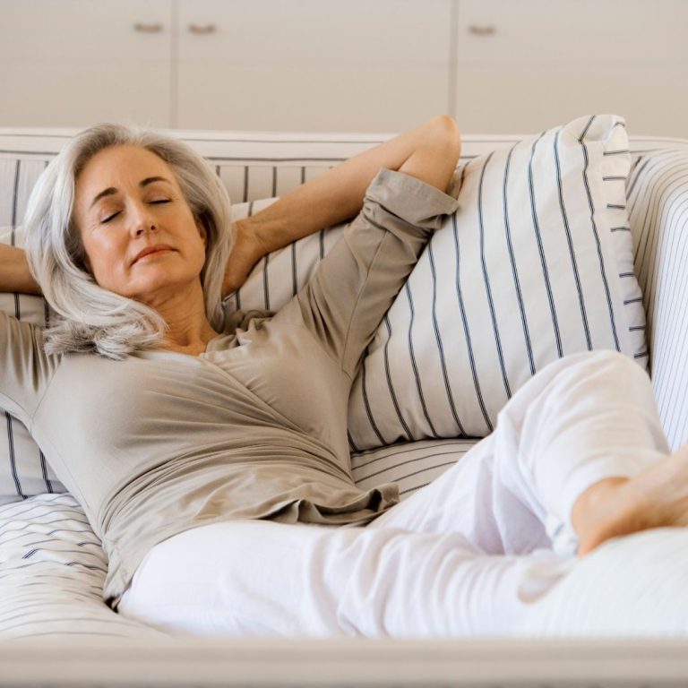 woman relaxing on sofa